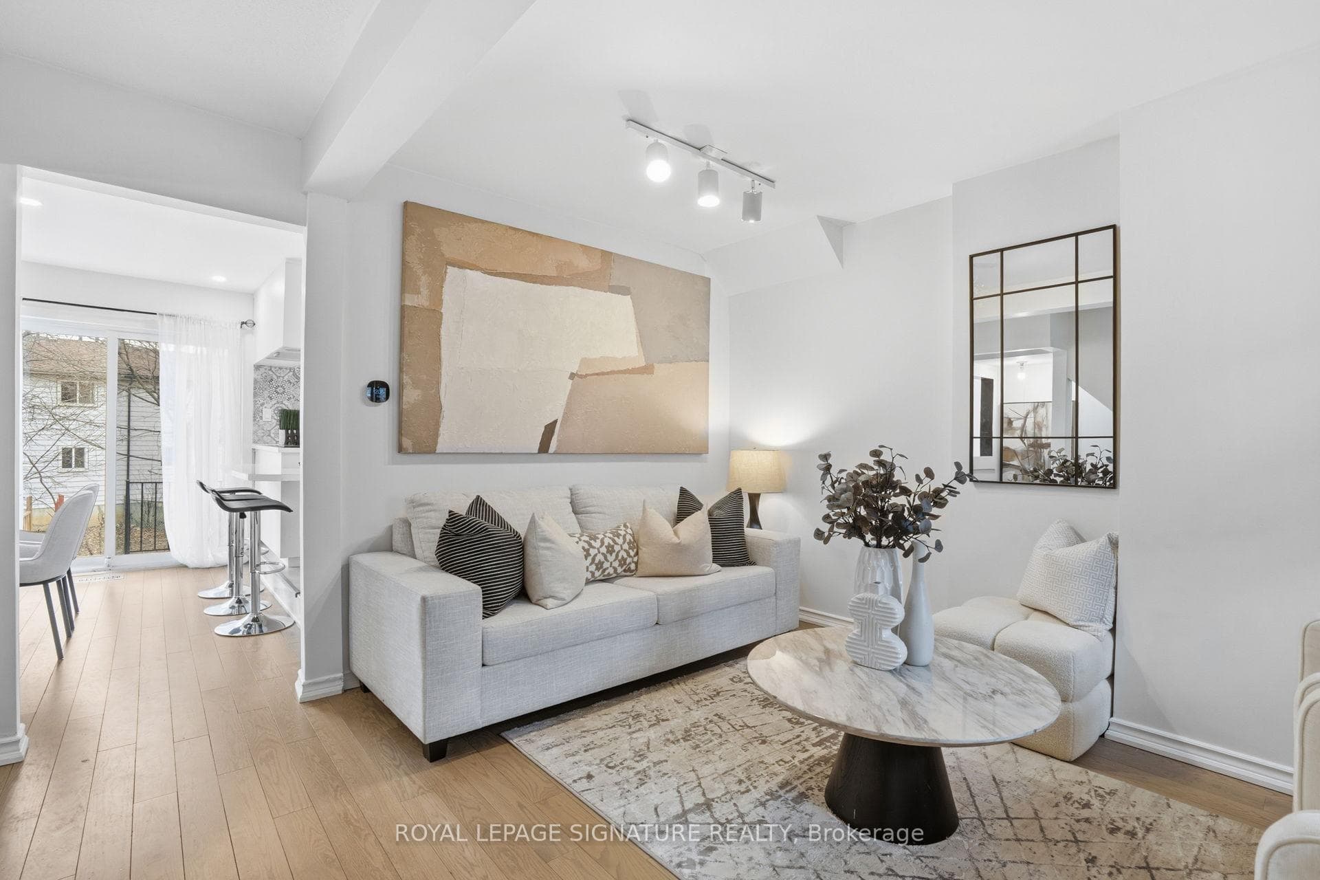 Staged living room at 26 - 50 Silverbell Grove in Toronto